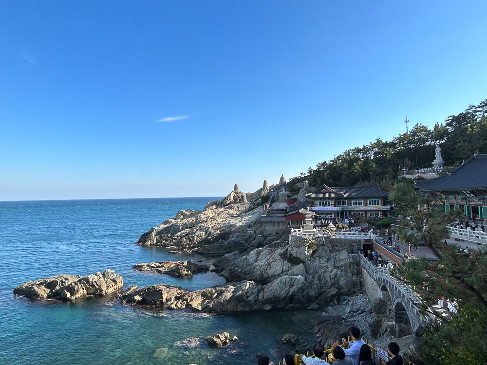 A view along the coast, including part of the Haedong Yonggungsa Temple complex.