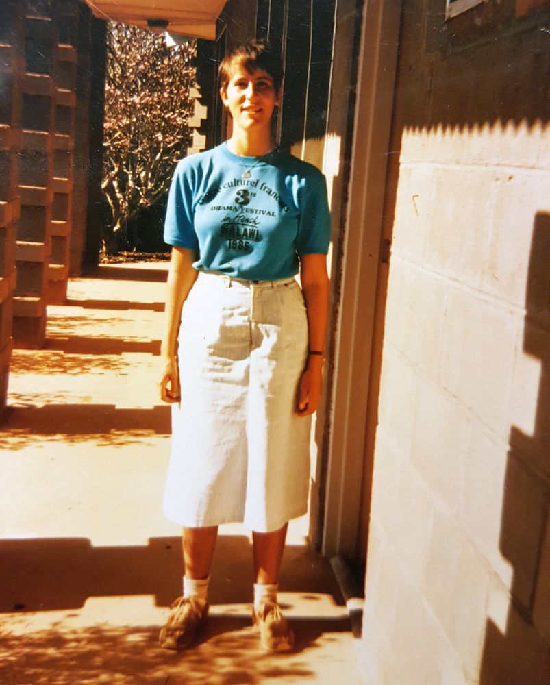 Me: short hair, t-shirt, straight skirt, socks and sneakers.