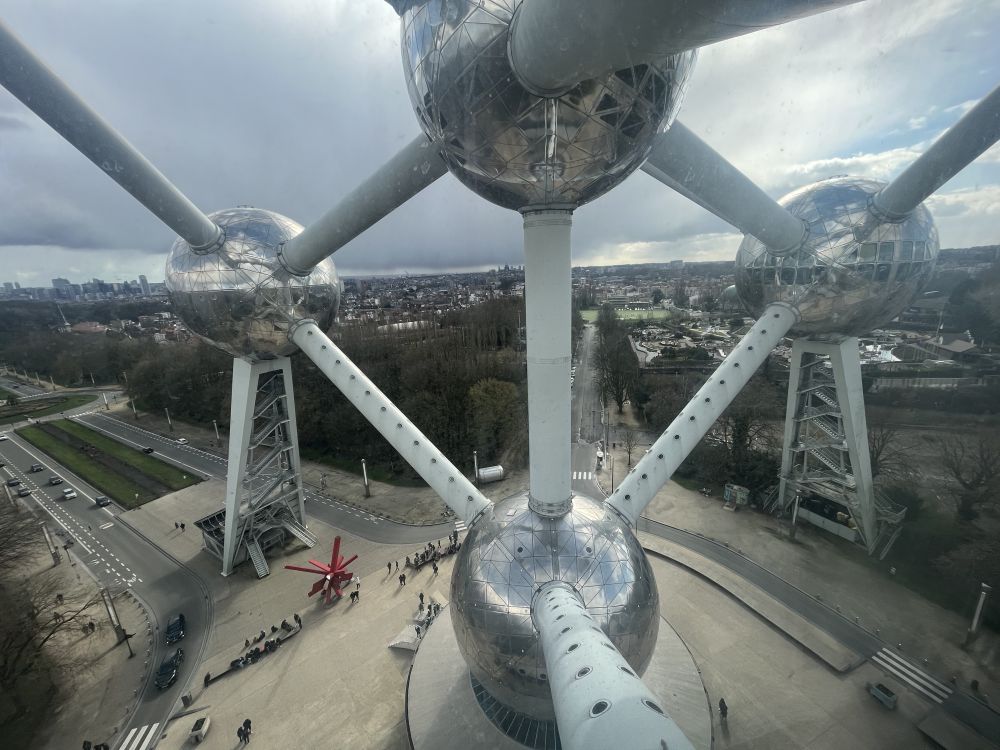 The Atomium is shaped like an atom - this picture looks from one of the "electrons" back toward the central "nucleus," with a view of Brussels in the background.