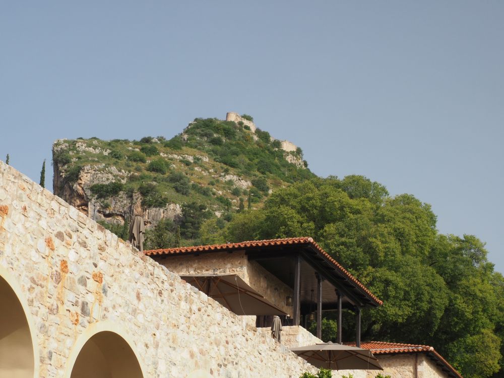 Ruined walls visible on the peak of a hill.