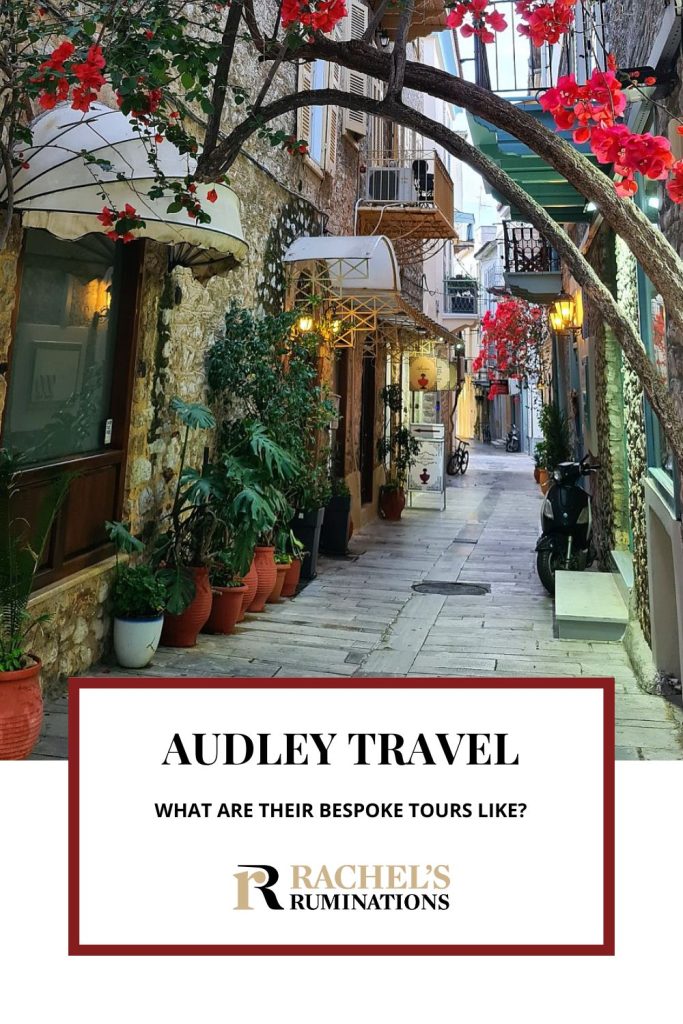 Text: Audley Travel: What are their bespoke tours like? (and the Rachel's Ruminations logo). Image: a view of a narrow city street, with lots of flowers and plants in pots and bougainvillea.