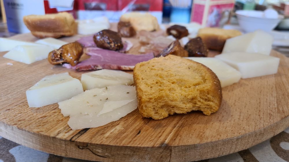 Chunks of cheese, bread, figs, meats