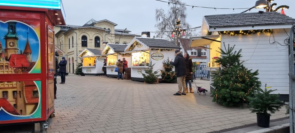 A few white-painted stalls in a neat line.