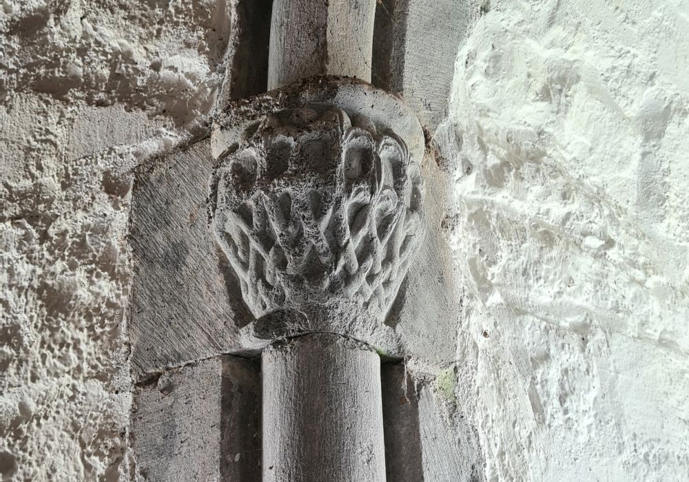 Leafy interlaced pattern carved in stone.