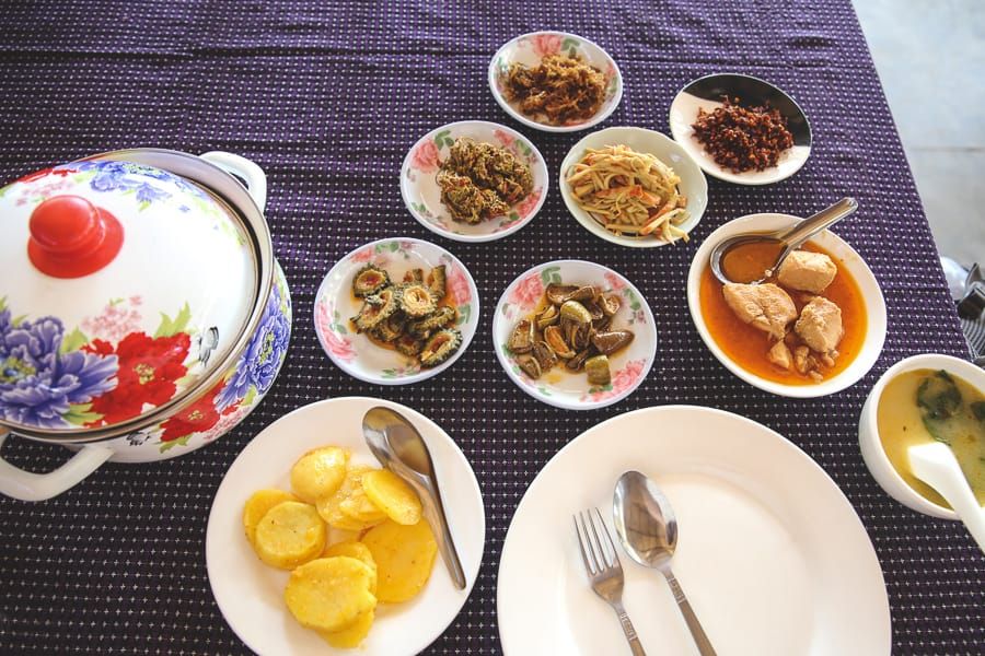 An array of small bowls, each with different foods in it.