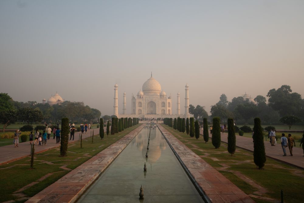 A view down the long reflecting pool to the Taj Mahal in the distance.