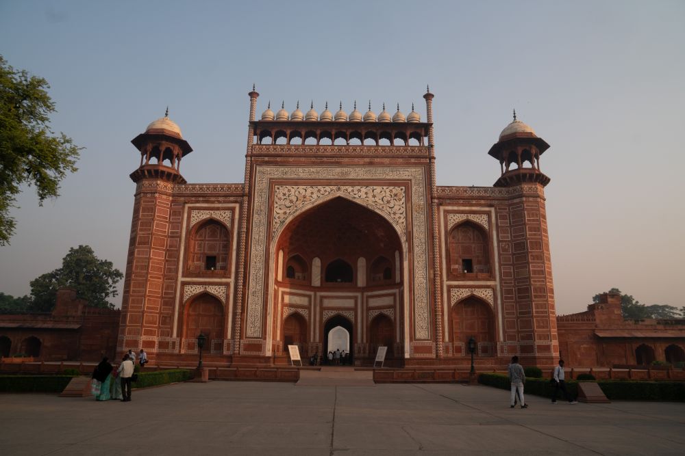 South gate, ornate, arched, made of red sandstone.