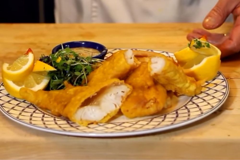 A plate of fried fish and chips.