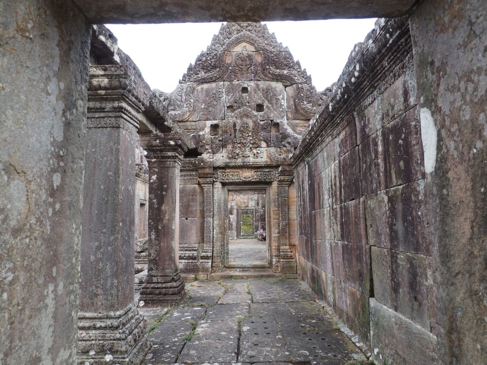 A view through several rooms of one of the Preah Vihear sanctuaries. Stone walls, no ceilings.