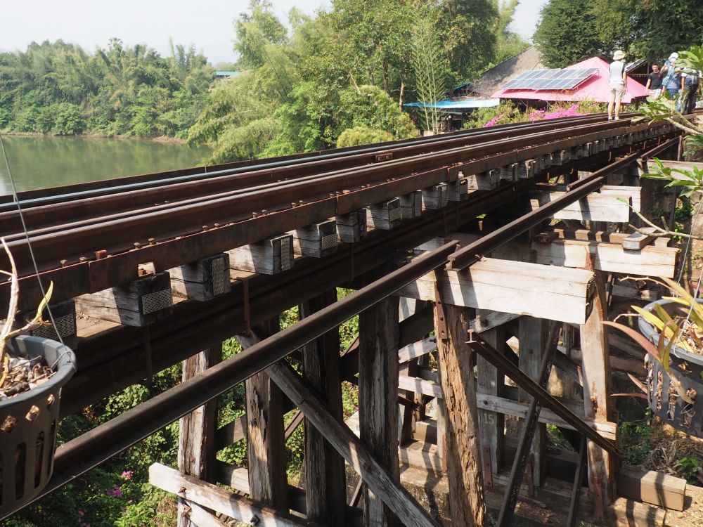 A section of the railway track showing the huge wooden poles that still support the track.