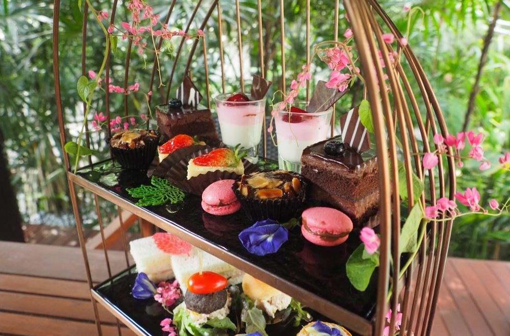 Various very colorful sweets and savory items on two shelves.