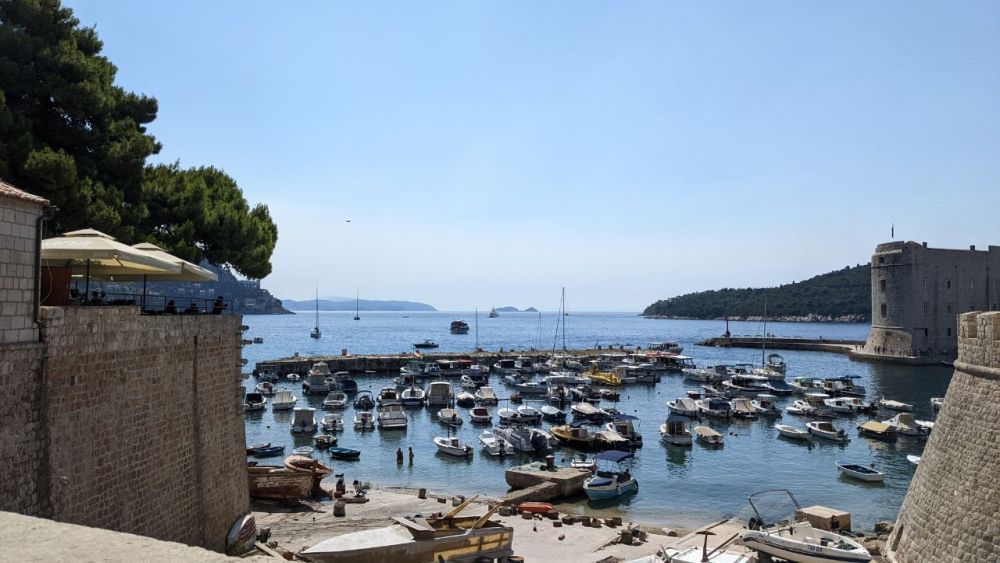 View to a small harbor filled with boats.