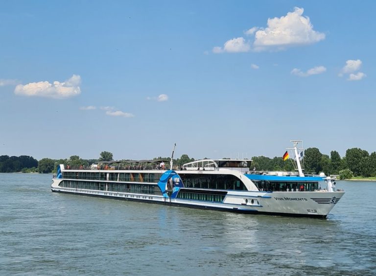 A view of a VIVA cruise ship: very long and narrow and just 3 stories high.