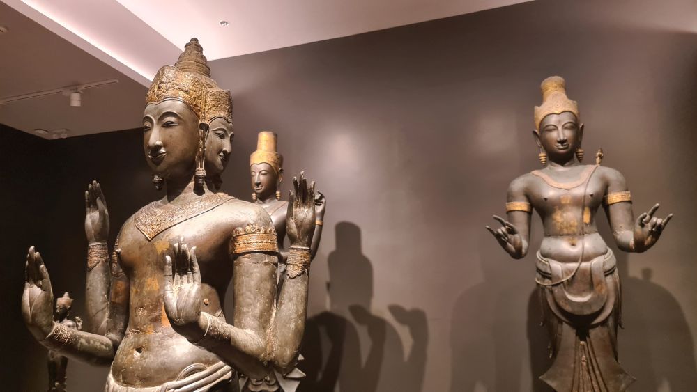 life-sized images of gods and goddesses, some with more than two arms.