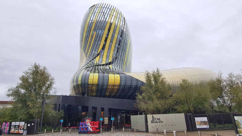 A curvy building with a strange roundish shape.