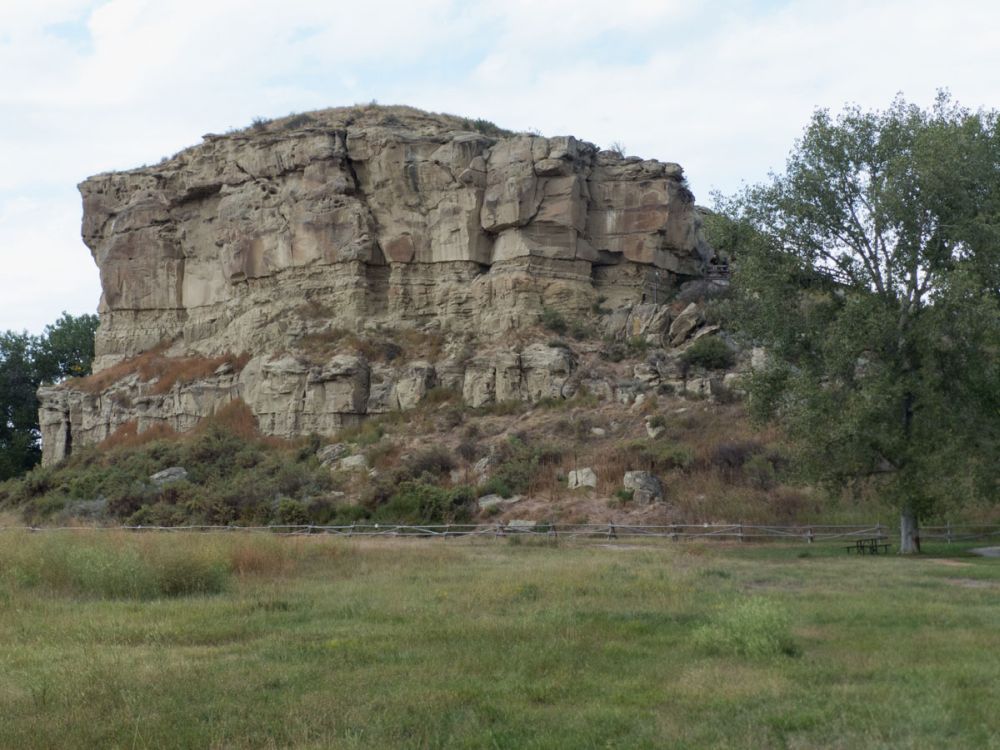 A large, steep-sided outcropping of rock.