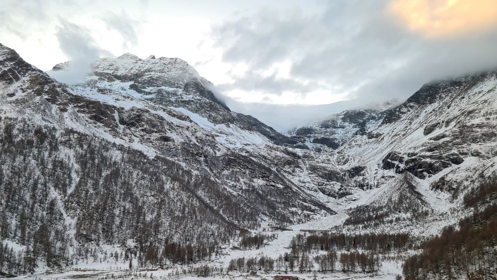 View of mountains, with snow in places.