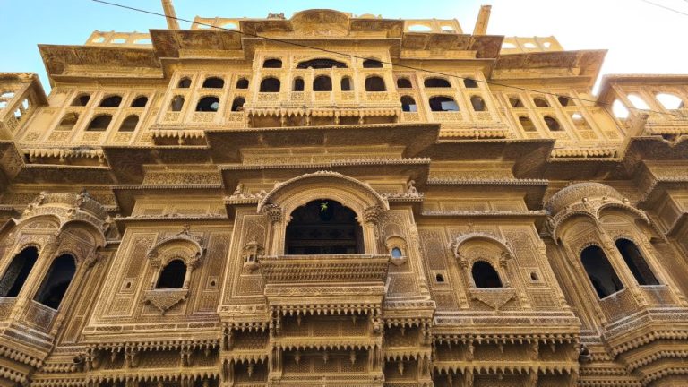 Front facade with many windows, the upper ones blank.