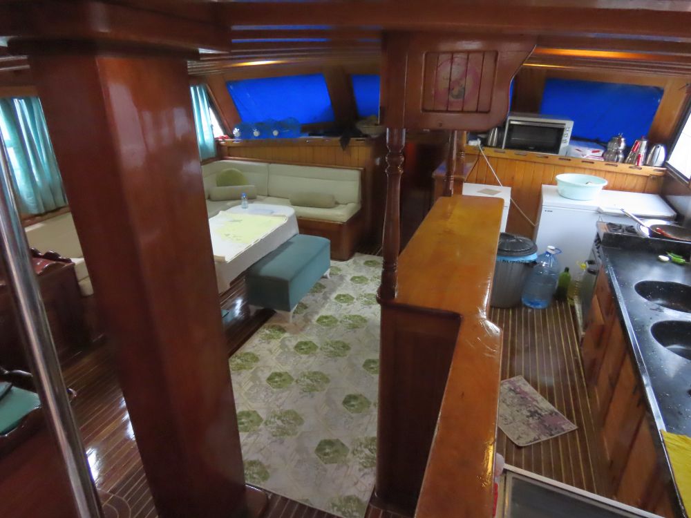 Looking down at the inside cabin, with the kitchen on the right and a counter dividing it from the rest of the space.