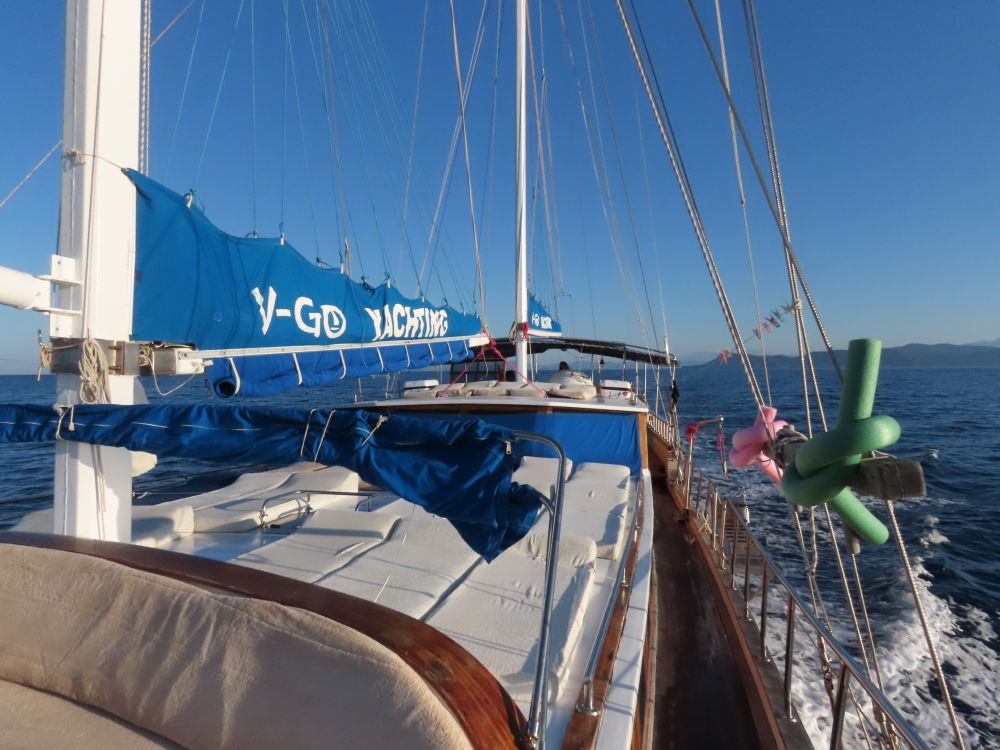 The deck in the center of the ship is covered with white single-sized mattresses.