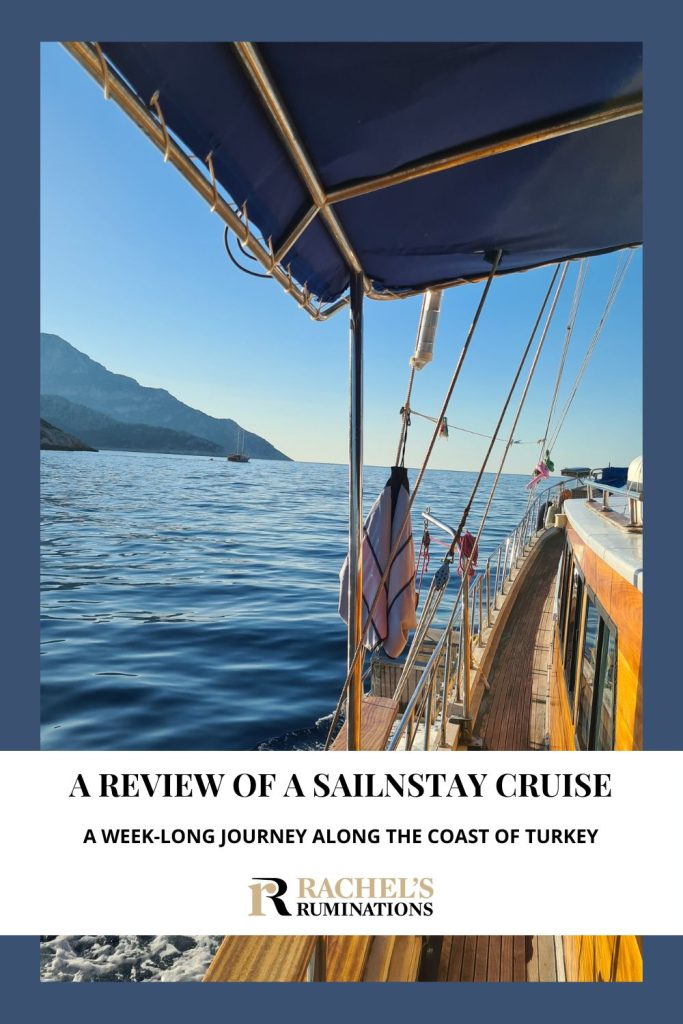 Text: A review of a Sailnstay cruise: A week-long journey along the coast of Turkey. Image: a view along the side of the boat showing sea and a distant hill.