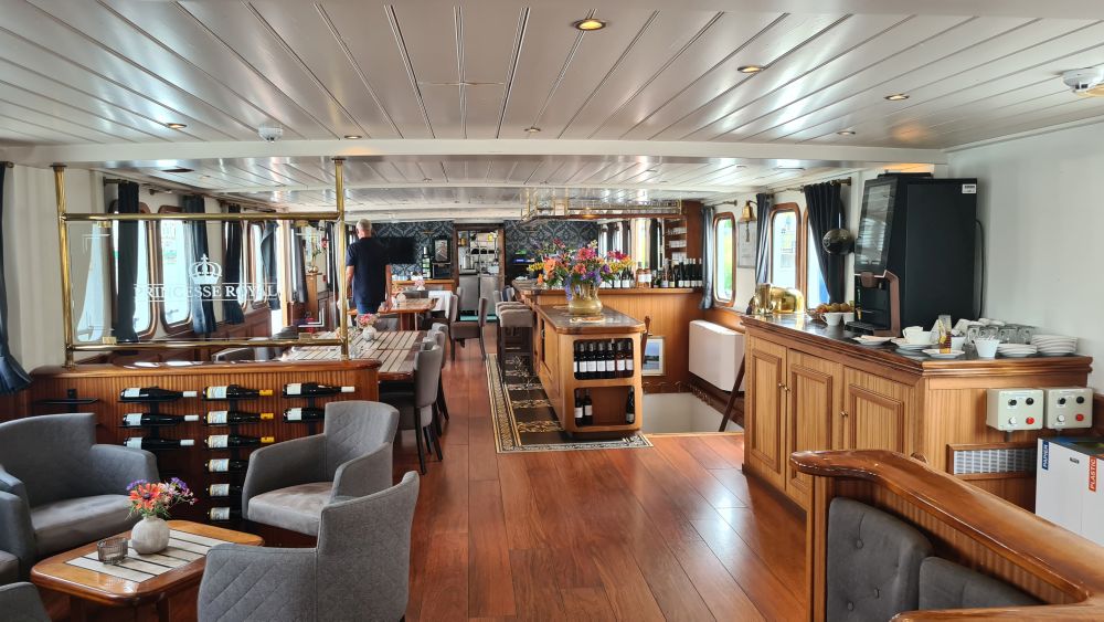 A view of part of the lounge and all of the dining room and bar.
