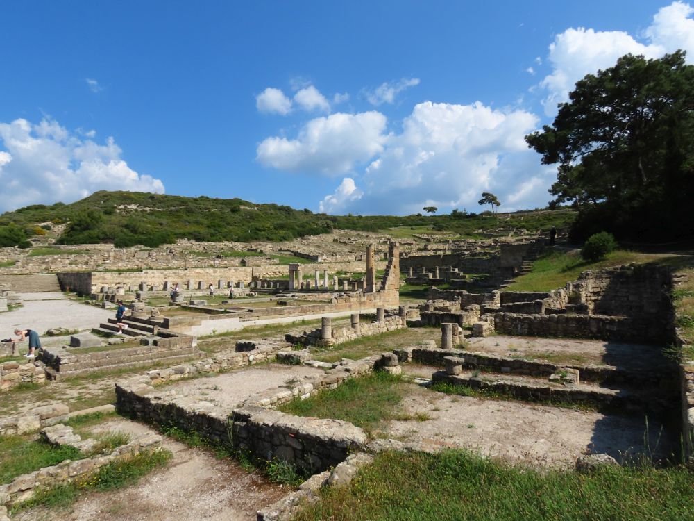 Various stone ruins, with partial columns around them.