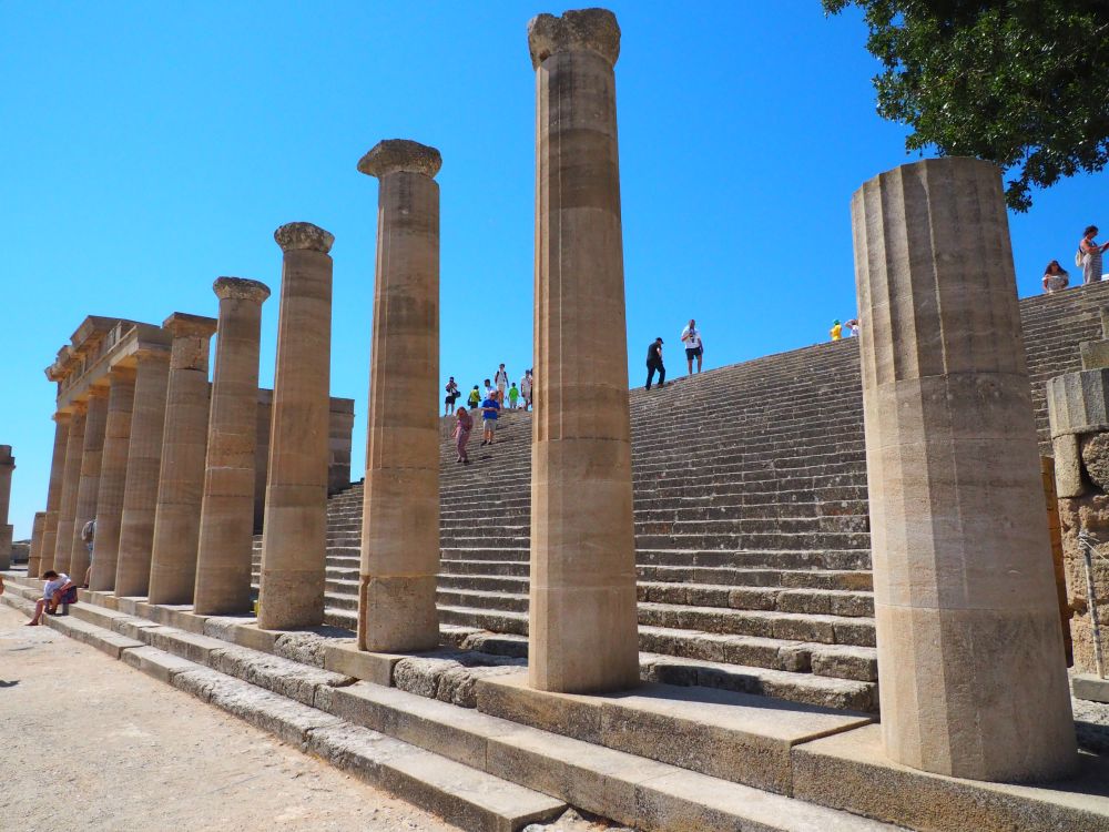 A very wide stairway with a row of partially complete columns on the 3rd step up.