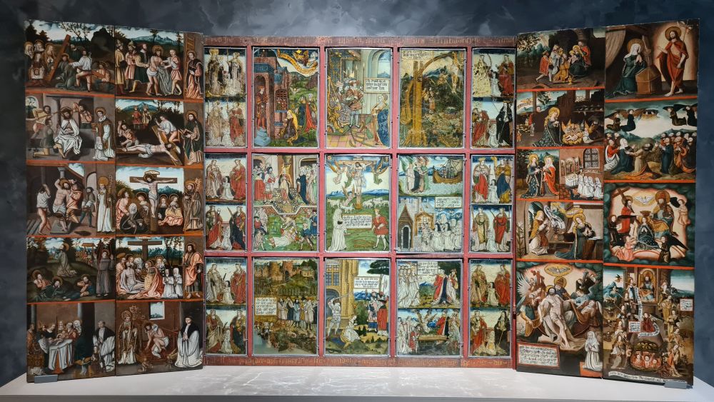 A 3-paneled altarpiece with sections showing Biblical scenes.