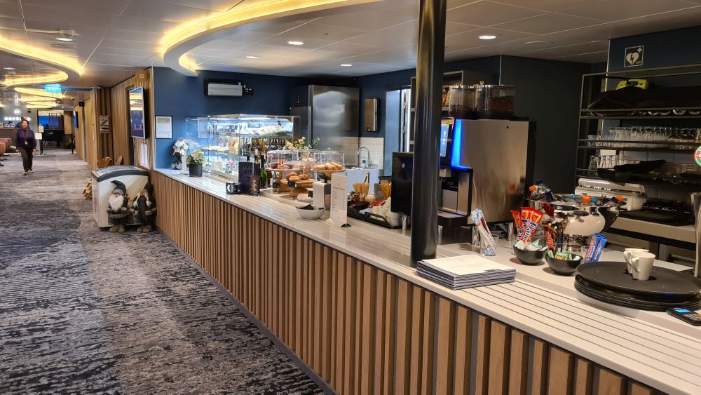 A long counter with various snack items displayed on it.