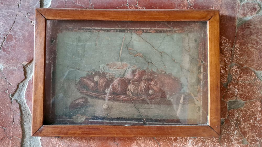 A still life of what looks like fruit in a bowl.