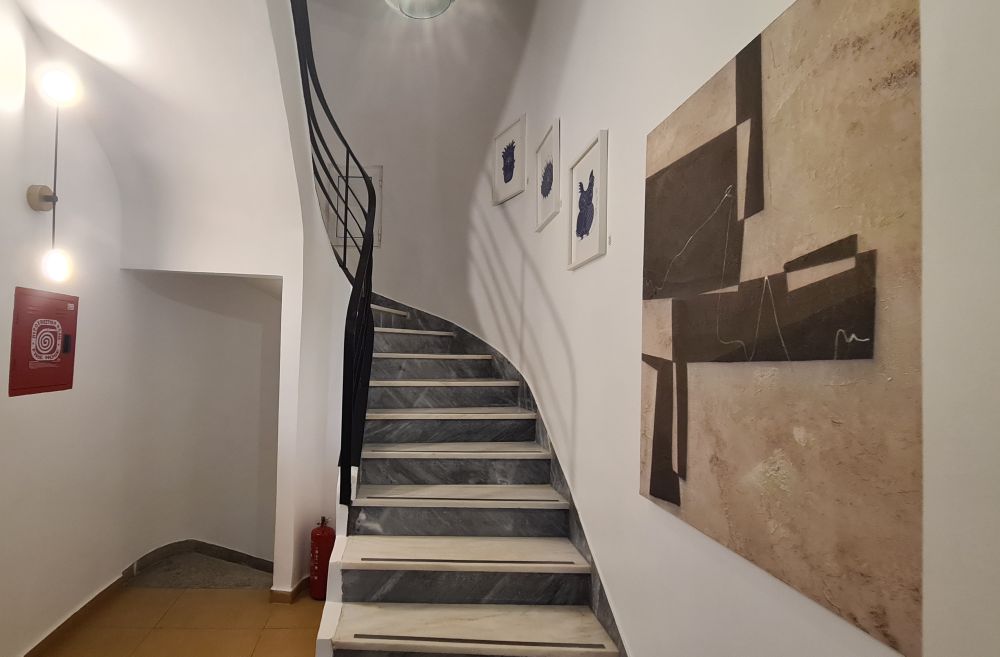 Looking up the stairway, which curves elegantly.