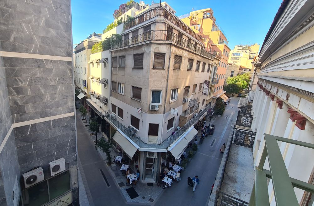 Looking down at a pedestrian street with an intersection.