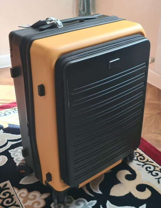 Standing-up view of the bag, with the little legs visible on the left side.