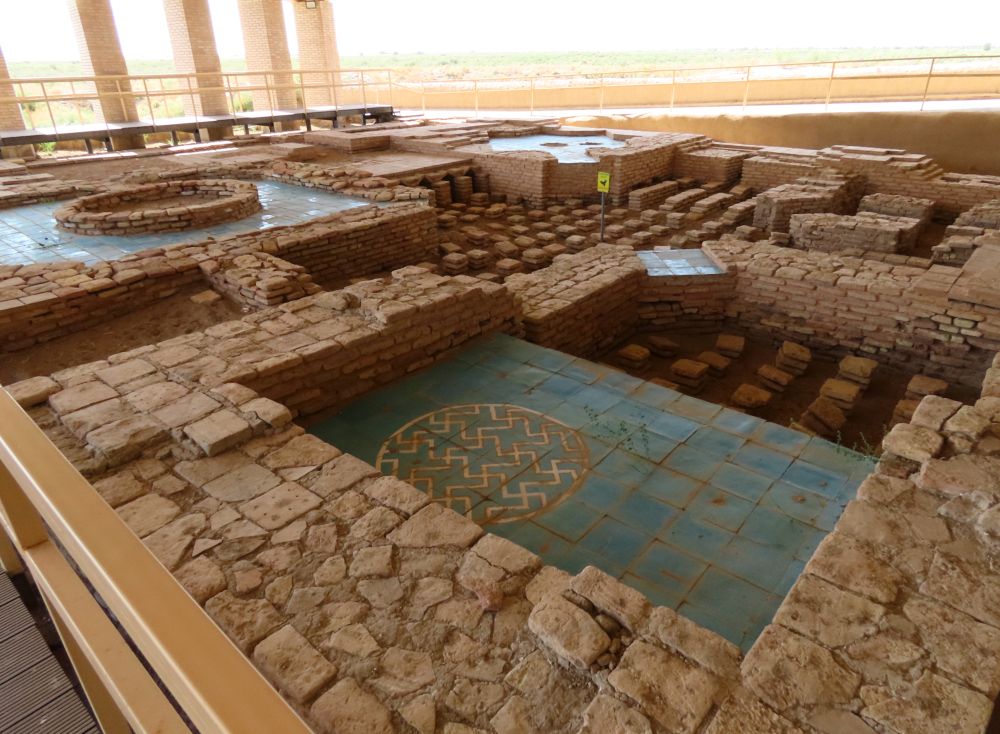 Ruins of the bathhouse with areas that are tiled.
